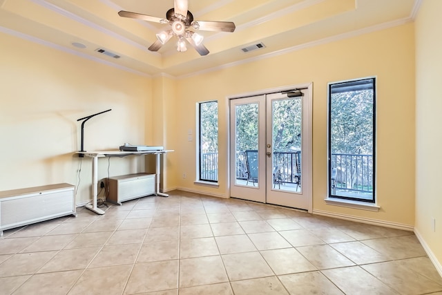 interior space featuring french doors, a tray ceiling, ceiling fan, and crown molding