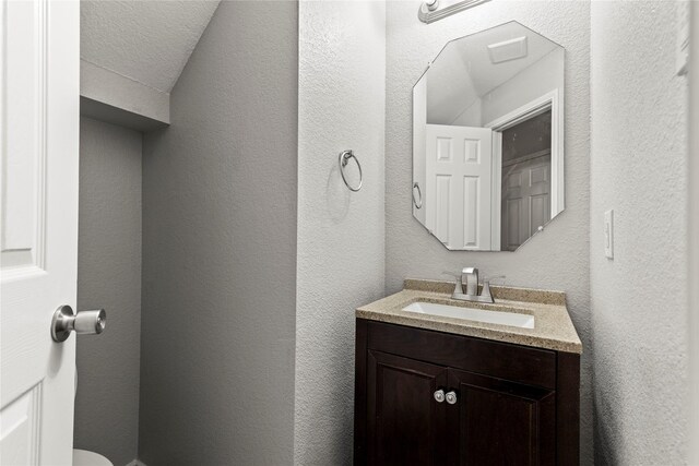 bathroom featuring vanity and a textured ceiling