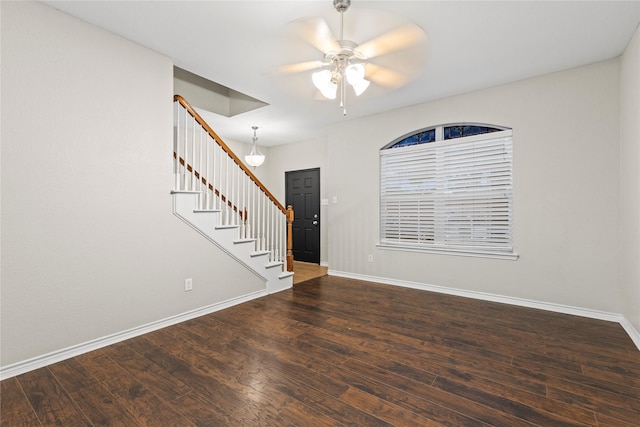 interior space featuring ceiling fan and dark wood-type flooring