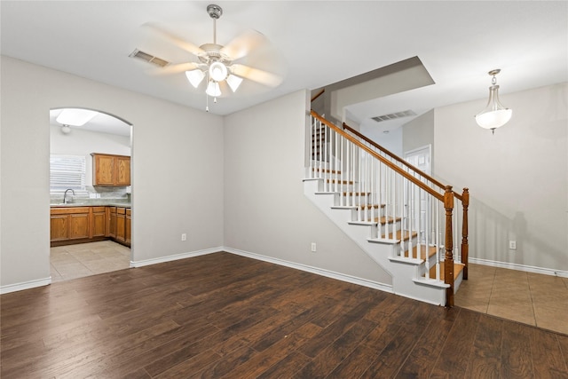 interior space featuring ceiling fan, sink, and light hardwood / wood-style flooring