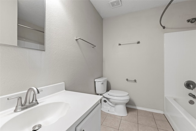 full bathroom featuring tile patterned flooring, vanity, a textured ceiling, and  shower combination