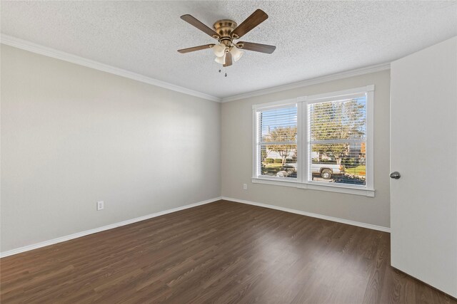 empty room with a textured ceiling, ceiling fan, ornamental molding, and dark wood-type flooring