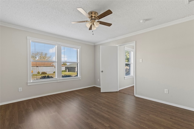 spare room with dark hardwood / wood-style flooring, a healthy amount of sunlight, and a textured ceiling