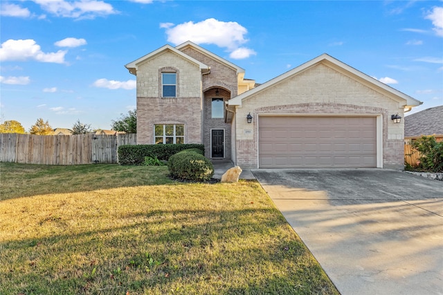 view of front facade with a front yard and a garage