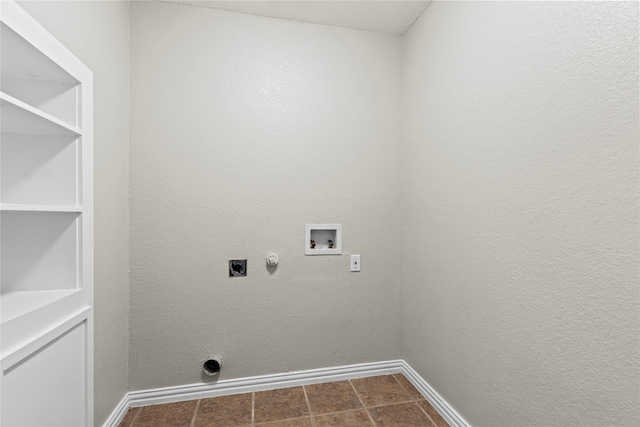 clothes washing area with tile patterned floors, hookup for a gas dryer, hookup for a washing machine, and hookup for an electric dryer