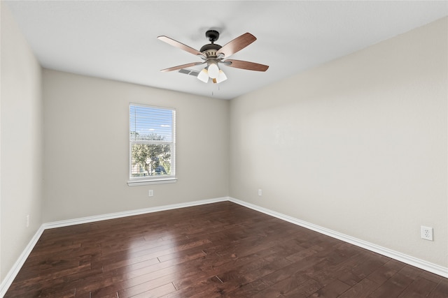 unfurnished room with ceiling fan and dark hardwood / wood-style floors