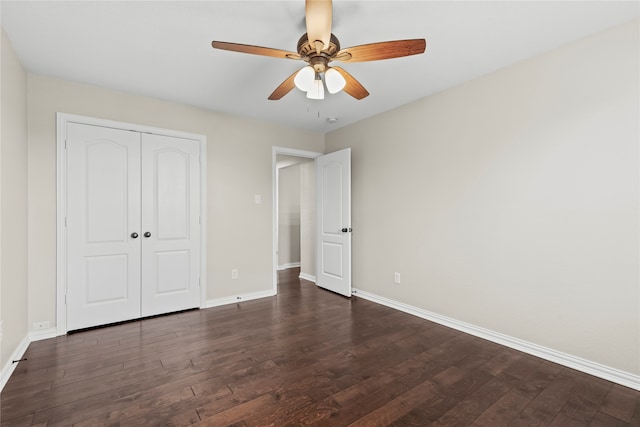 unfurnished bedroom with a closet, ceiling fan, and dark hardwood / wood-style flooring