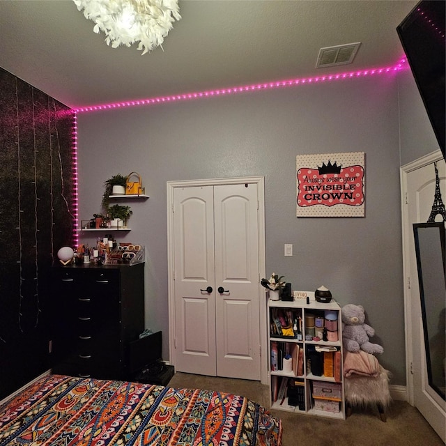 carpeted bedroom featuring a closet