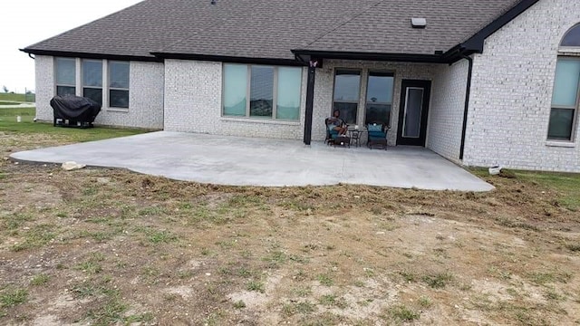 back of house with a patio