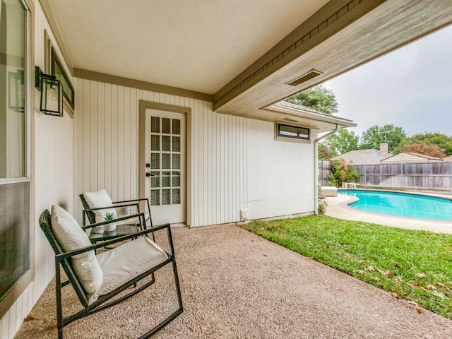 view of patio with a fenced in pool