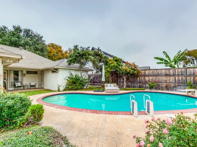 view of swimming pool featuring a patio area