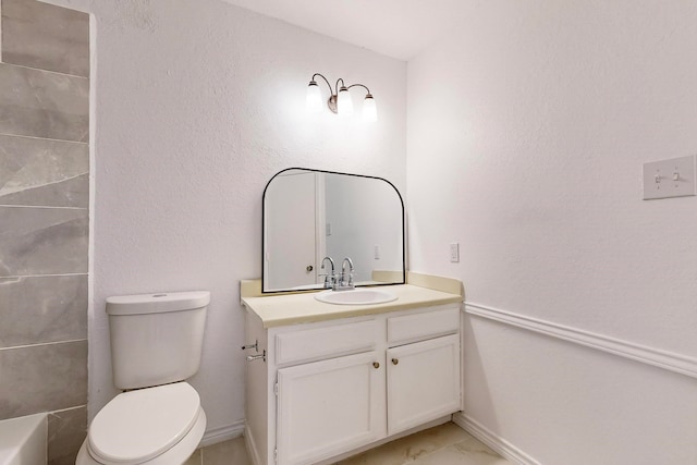 bathroom with vanity and toilet