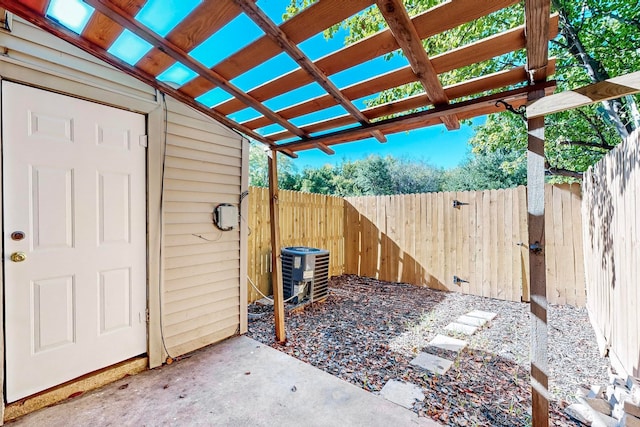 view of patio / terrace featuring a pergola and central air condition unit