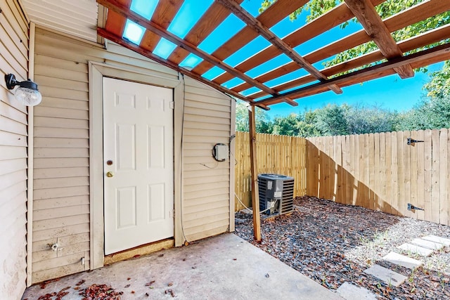 view of outdoor structure featuring a pergola and cooling unit