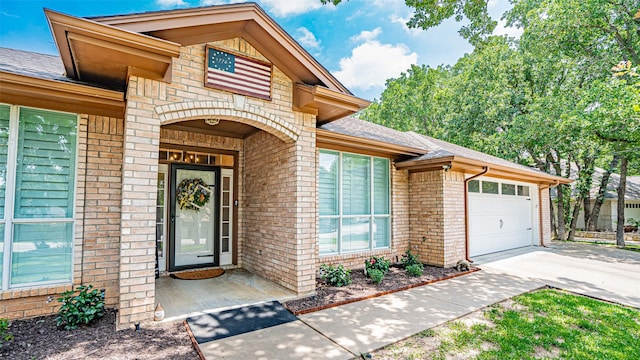 view of exterior entry featuring a garage