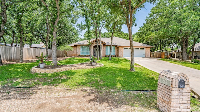 ranch-style house with a front yard and a garage