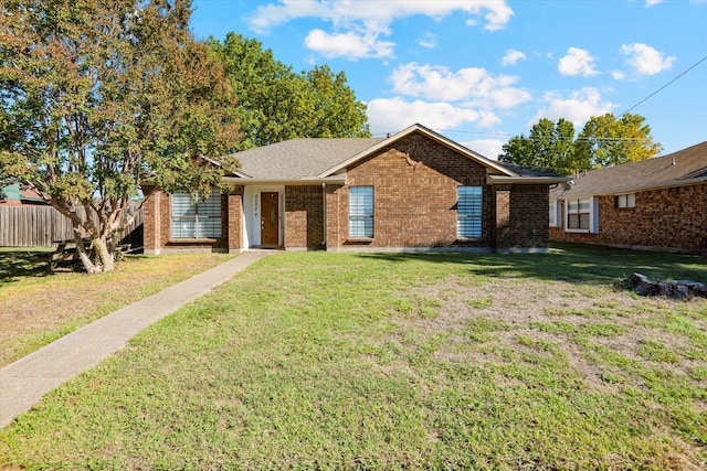 single story home with a front lawn