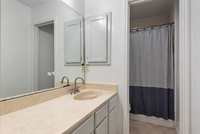 bathroom featuring tile patterned flooring, vanity, and a shower with shower curtain