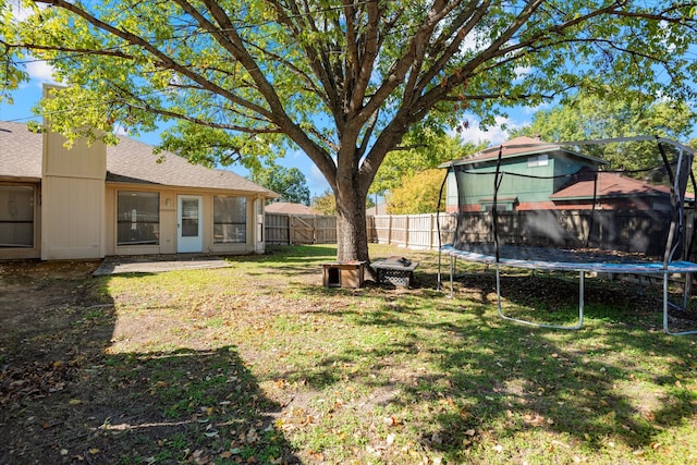 view of yard with a trampoline