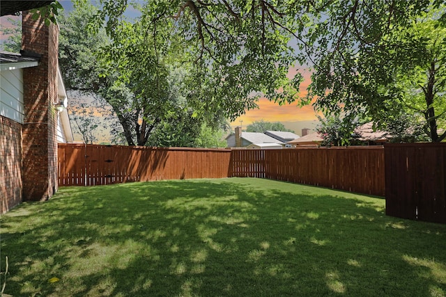 view of yard at dusk