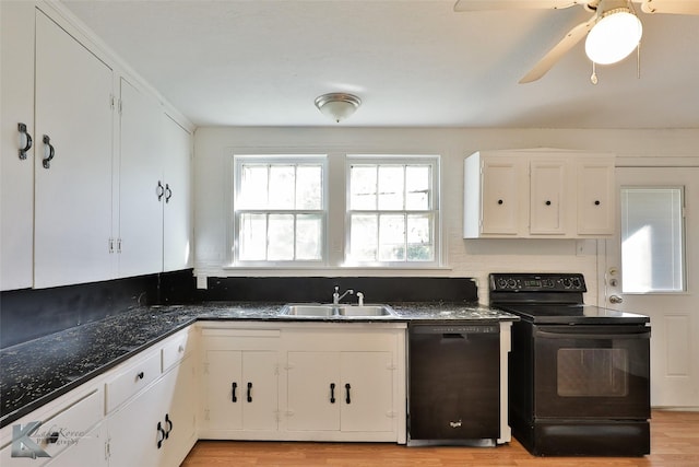 2909 Poplar St, Abilene, TX 79602 - kitchen featuring black appliances, a sink, white cabinetry, and light wood-style floors