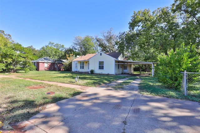 single story home with a carport and a front lawn