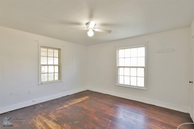 2909 Poplar St, Abilene, TX 79602 - unfurnished room with a ceiling fan, dark wood finished floors, and baseboards