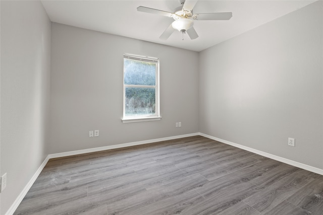 empty room featuring light hardwood / wood-style floors and ceiling fan