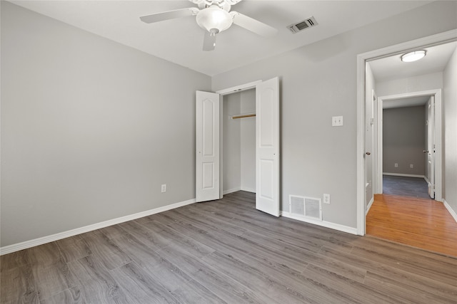 unfurnished bedroom featuring ceiling fan and light wood-type flooring