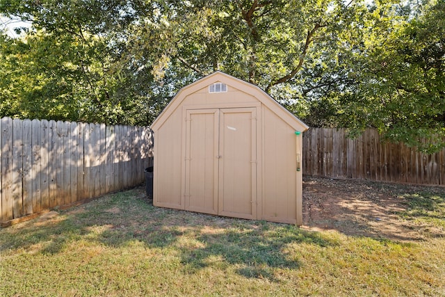 view of outbuilding with a lawn