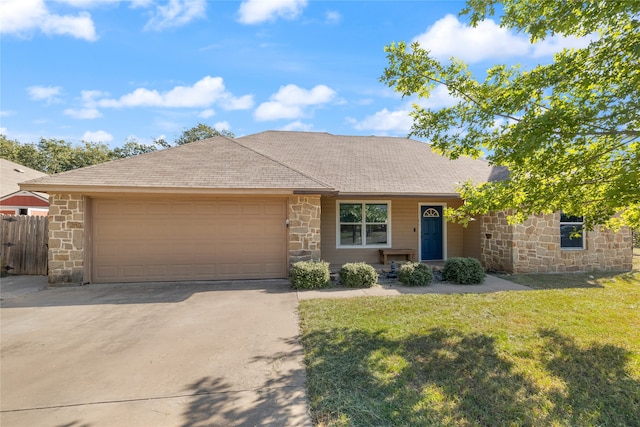 ranch-style home featuring a garage and a front lawn