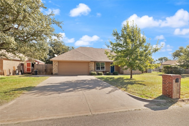 view of front of property with a garage and a front yard