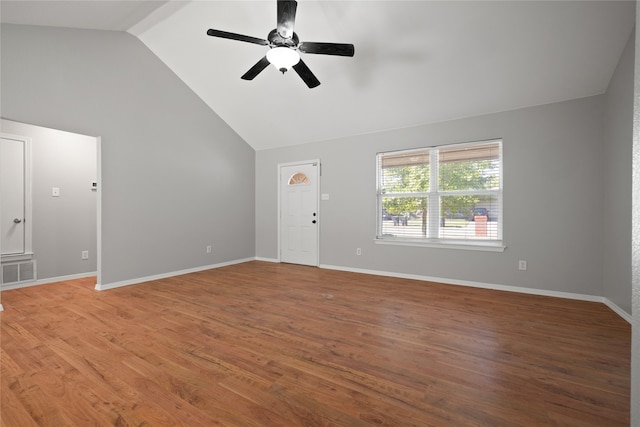 unfurnished living room featuring wood-type flooring, high vaulted ceiling, and ceiling fan