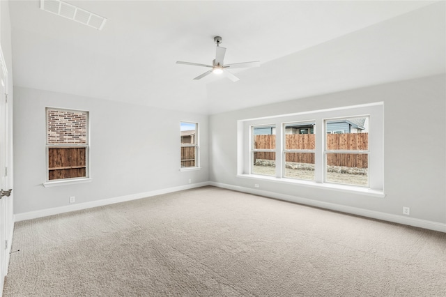 spare room featuring carpet flooring and ceiling fan