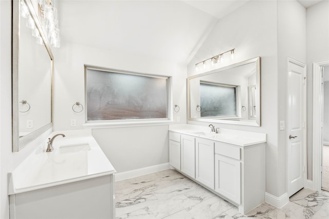 bathroom with vanity and lofted ceiling