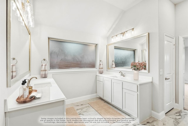 bathroom featuring vanity and vaulted ceiling