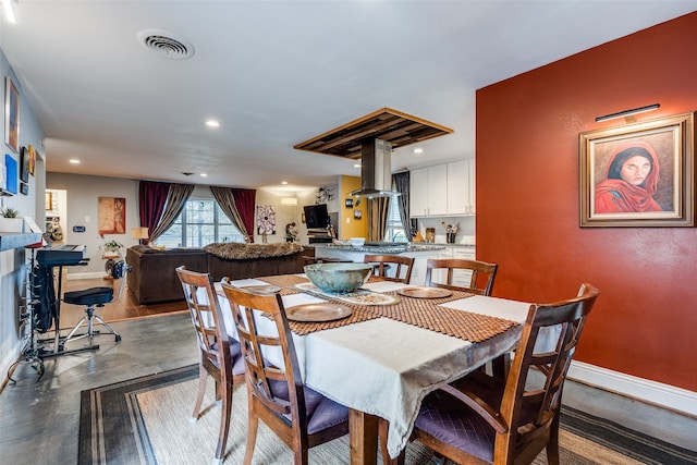 dining room with concrete flooring