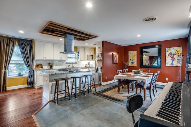 dining room featuring dark hardwood / wood-style flooring and sink