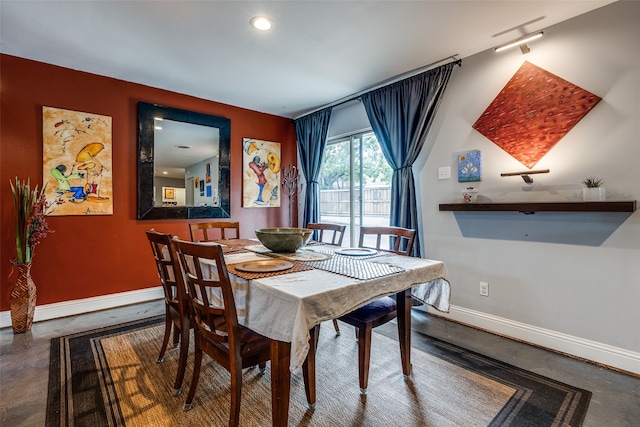 dining area with concrete floors