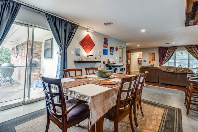 dining room with concrete flooring