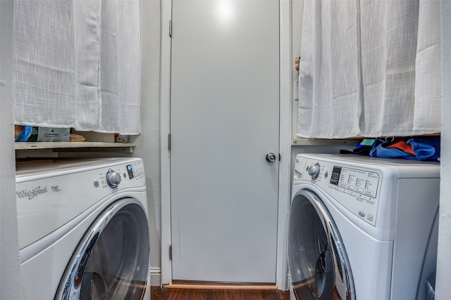 laundry room featuring independent washer and dryer and dark hardwood / wood-style floors