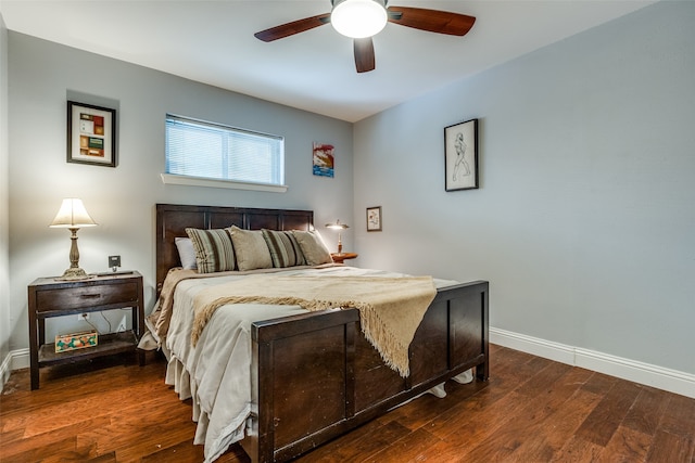 bedroom with ceiling fan and dark wood-type flooring