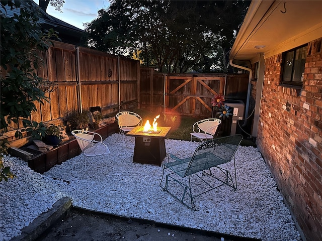 view of patio with a fire pit