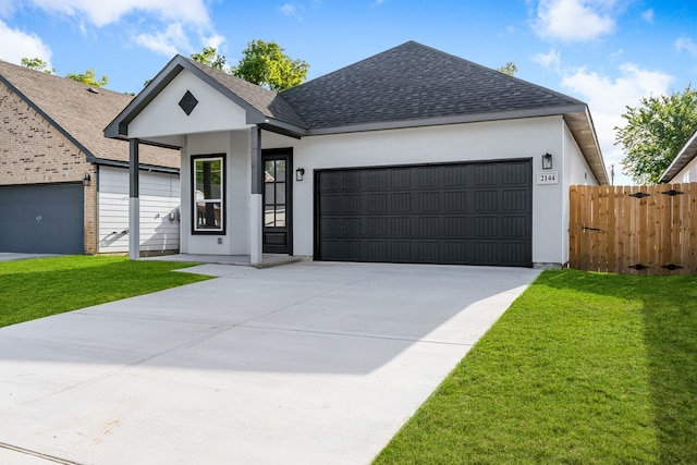 view of front facade with a front yard and a garage