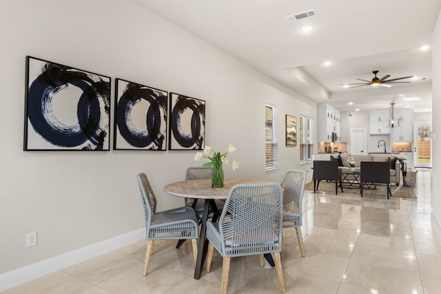 dining space featuring ceiling fan