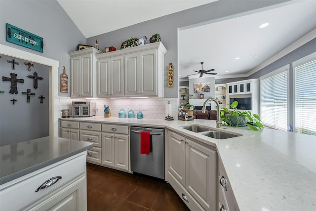 kitchen featuring white cabinets, dishwasher, backsplash, and a sink