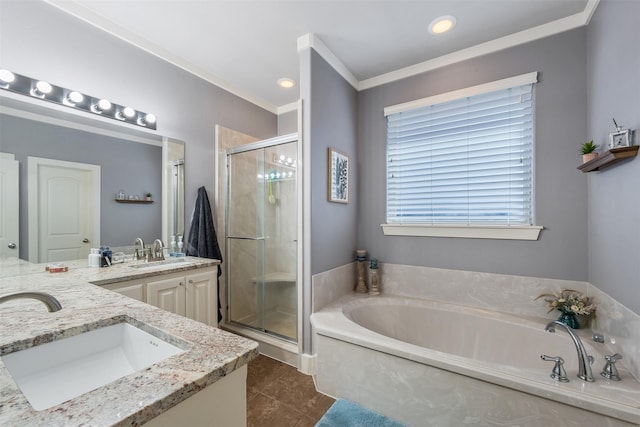 bathroom featuring double vanity, a stall shower, a sink, and a bath