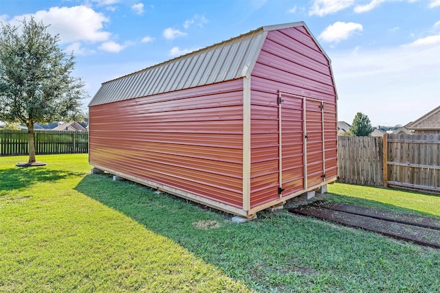 view of shed with a fenced backyard