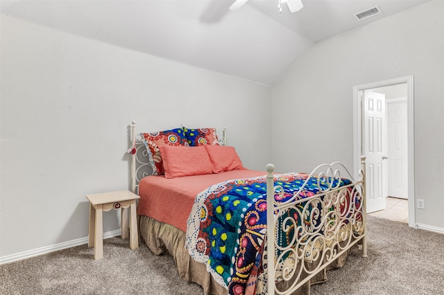 carpeted bedroom with vaulted ceiling and ceiling fan