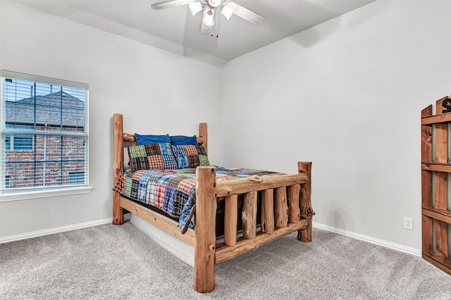 bedroom featuring carpet, ceiling fan, and multiple windows